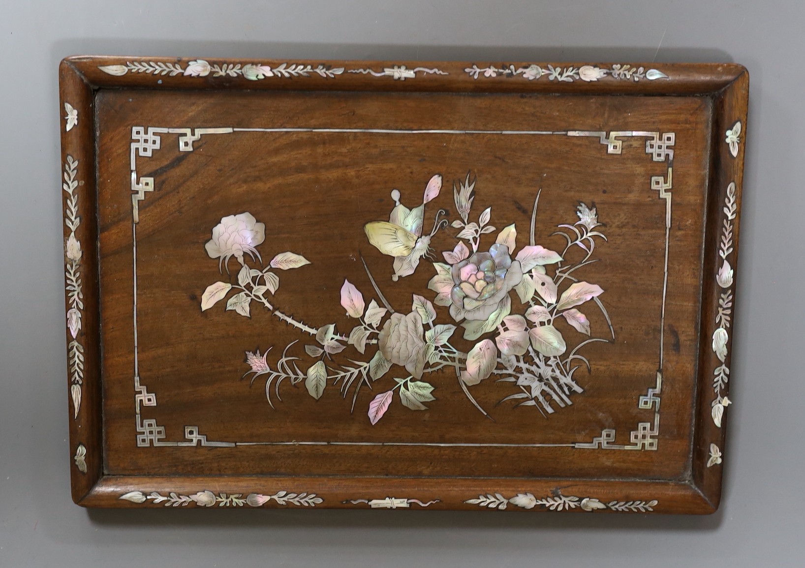 A Chinese mother of pearl inlaid wood tray with bordered decoration, 29.5cm wide
